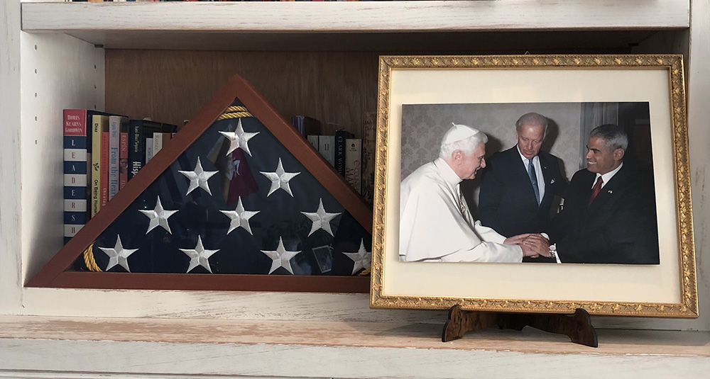 In a photo on his bookshelf, Miguel Díaz, right, greets Pope Benedict XVI during the meeting at the Vatican with then-U.S. Vice President Joe Biden in June 2011. (Provided photo) In a photo on his bookshelf, Miguel Díaz, right, greets Pope Benedict XVI during the meeting at the Vatican with then-U.S. Vice President Joe Biden in June 2011. (Provided photo)